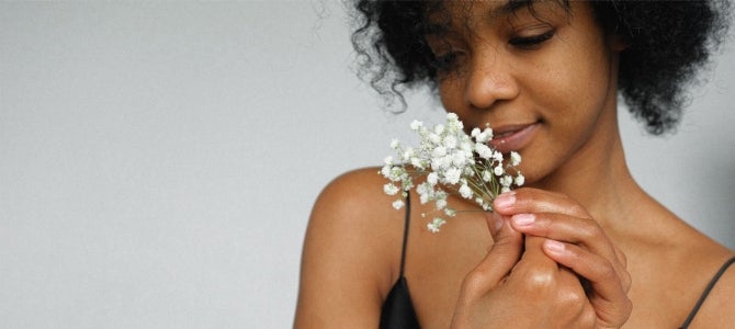 women smelling baby's breath flowers