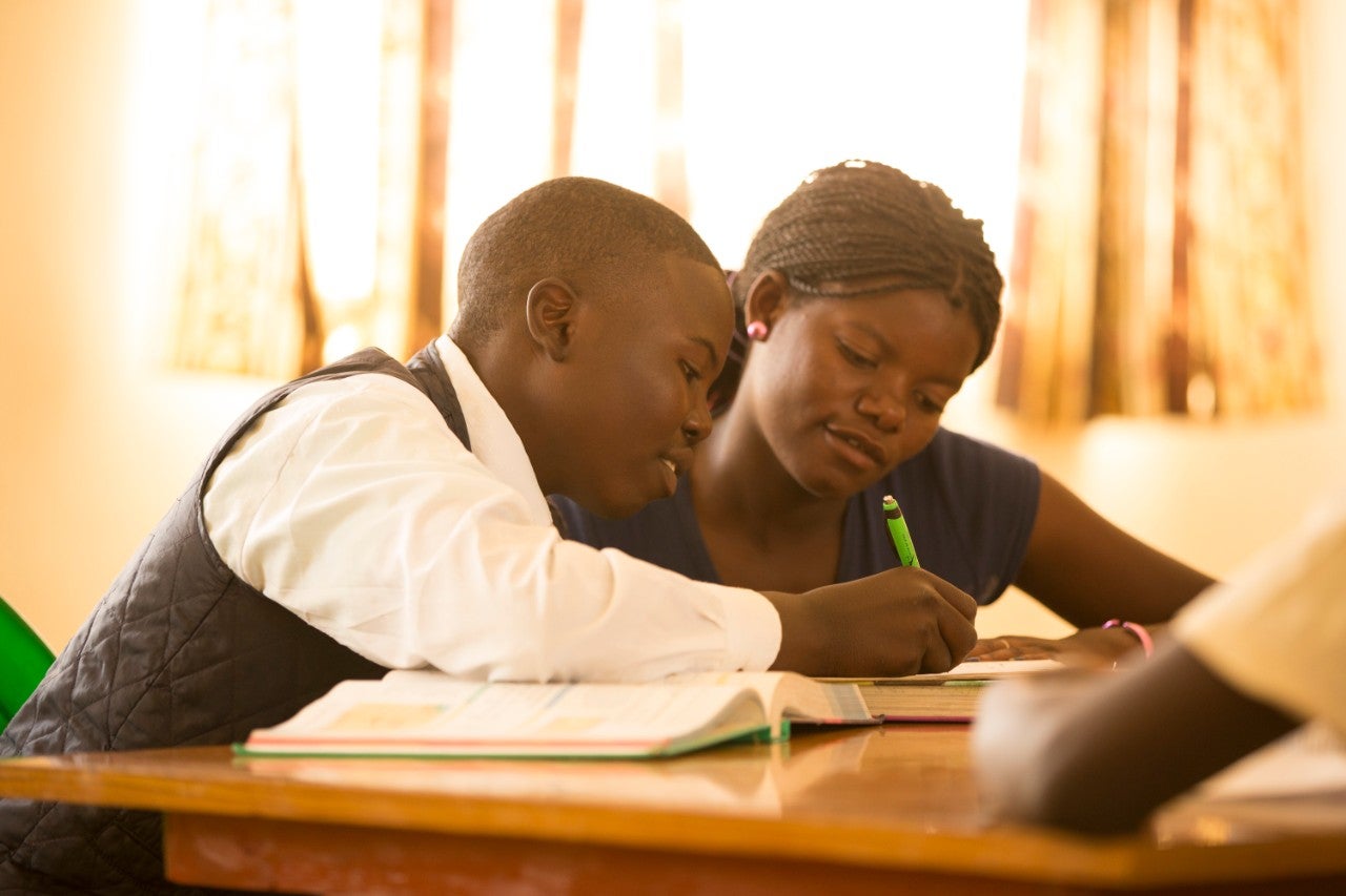 Malawi boy receiving education through the Educate the Children program