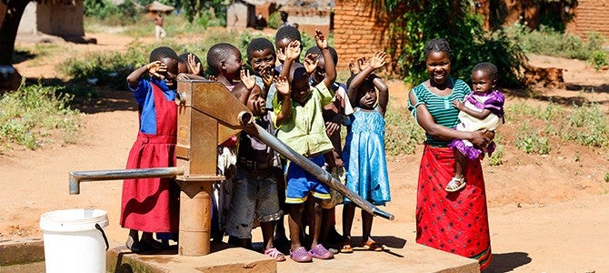 Malawi children by a SAFI donated water well