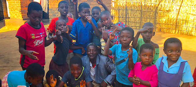 A group of children from the Community Based Child Care in Malawi pose for a picture.