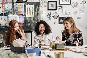three women working a table