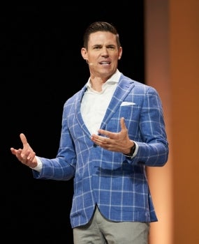 IMG_0090 Ryan Napierski speaking at the 2018 Nu Skin Americas Convention.