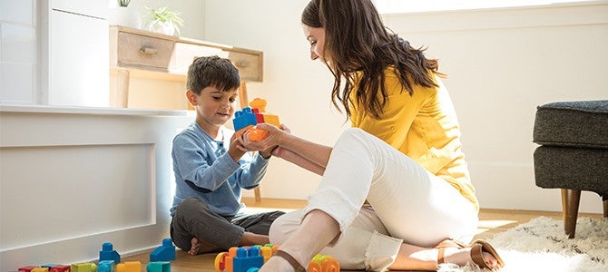 Healthy-Community-#3 mom playing legos with son