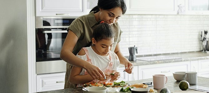 mother and daughter cooking in the kitchen 