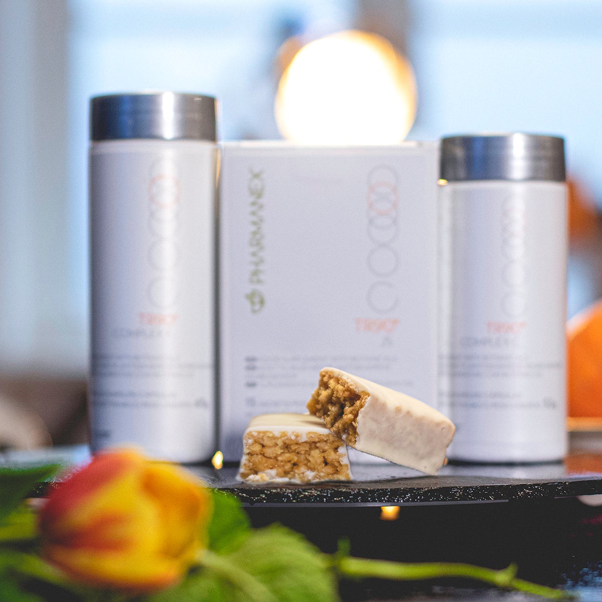 Pharmanex TR90 30-day weight management program products with TR90 M-Bar chocolate and lemon crisp flavour in the front and TR90 Complex C, Complex F and JS in the background.