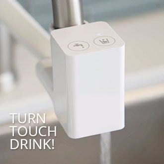 Photo of premium diverter connected to tap with flowing water