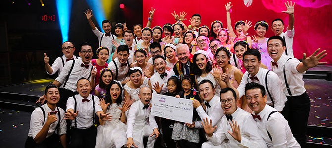 Korea Nu Skin Sales Leaders pose for a picture as they are given a giant check to their Nu Skin charity of choice as their prize for winning Nu Skin’s Got Talent.