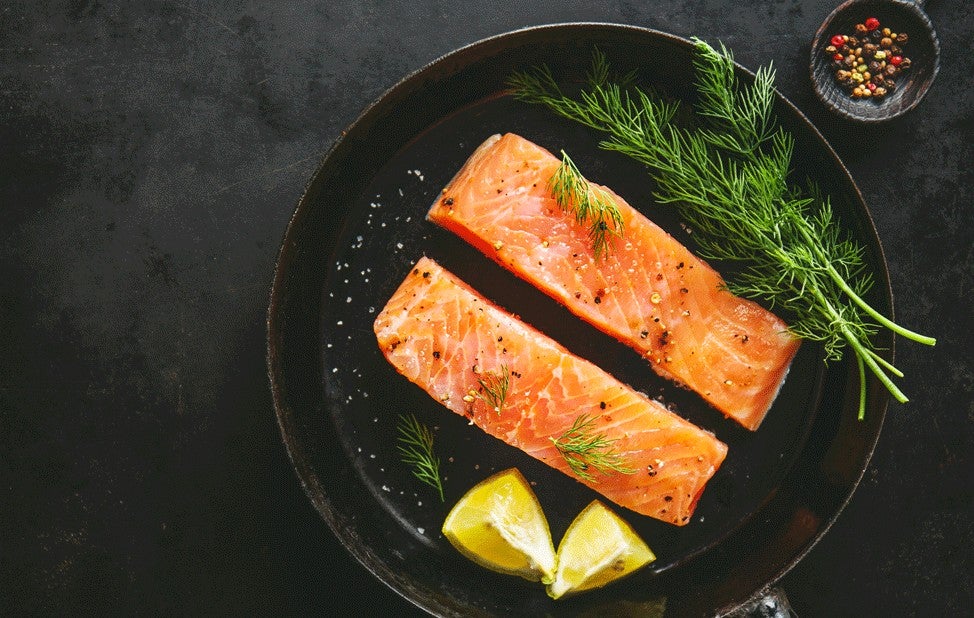 Raw salmon fish on vintage pan 